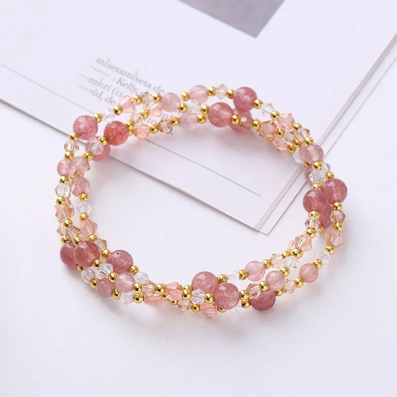 Women's three-ring crystal bracelet in tourmaline, strawberry quartz, or amethyst on an adjustable cord.