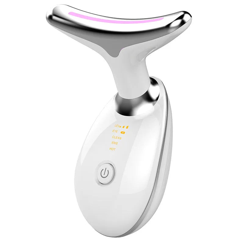 Black and silver EMS thermal neck lifting massager with LED lights on a skincare shelf.