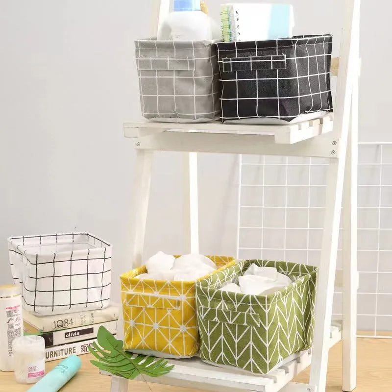 Foldable Oxford cloth desktop storage basket, 20x14x16cm, shown in a patterned pastoral style.