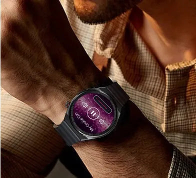 Smartwatch with round black casing and black steel strap on a wrist, showing home screen on its 1.39 inch display.