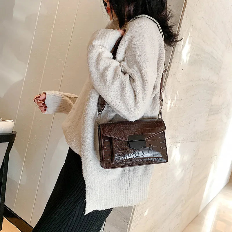 Vintage style crossbody bag in PU material showing dimensions of 20cm wide by 14cm high
