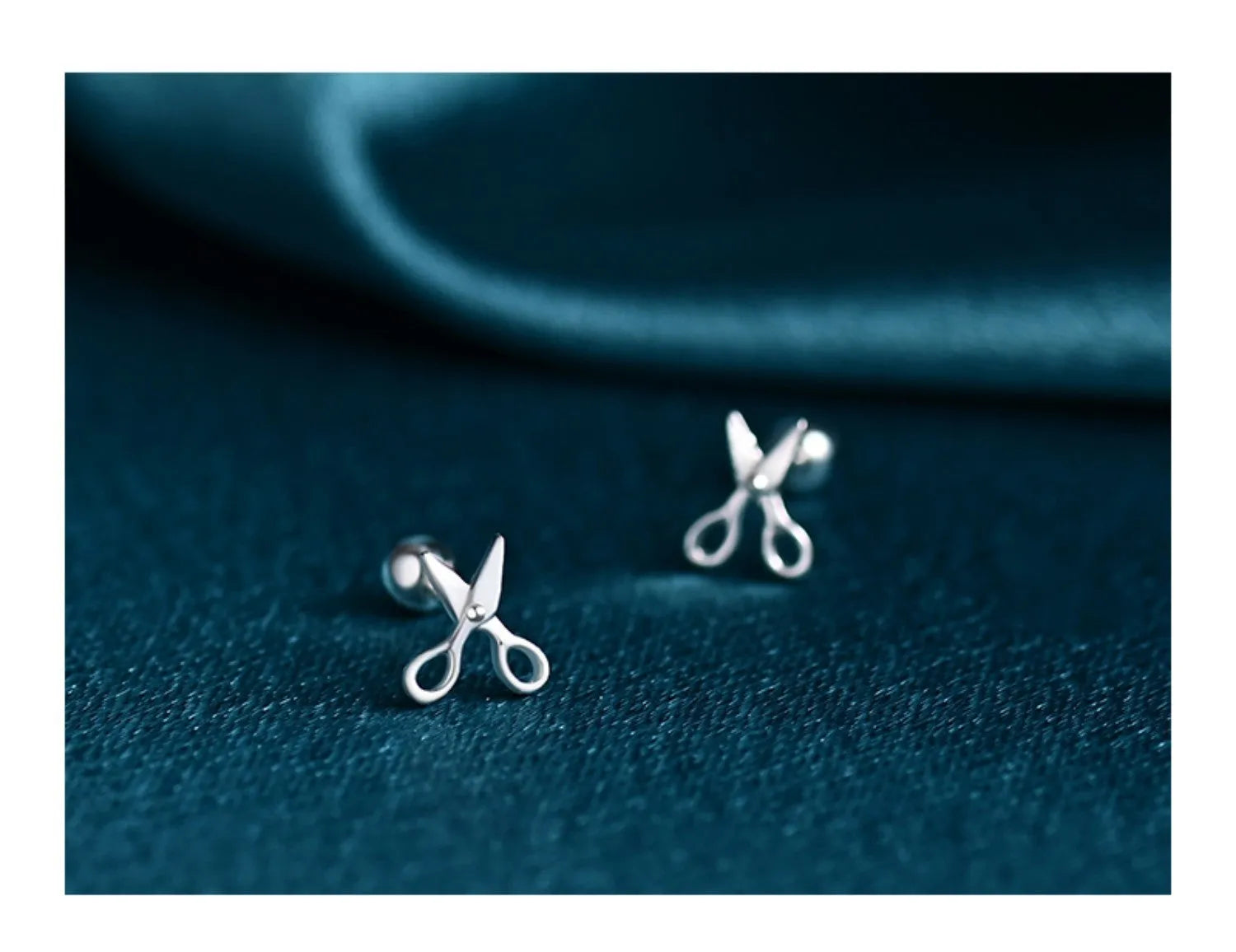 A pair of S999 pure silver ear nail earrings with a mini scissors and screws design.