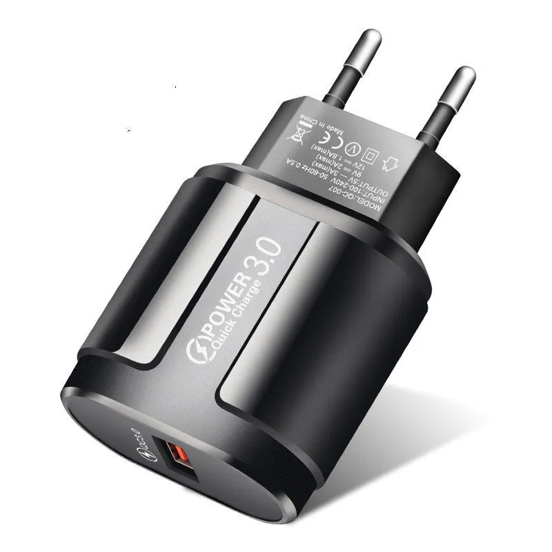 Compact black and white mobile phone chargers with EU UK US adapter options