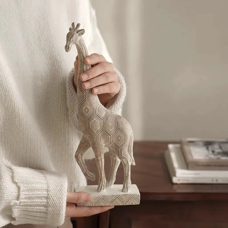 Wood colour European style synthetic resin giraffe ornament measuring 30.5cm tall.