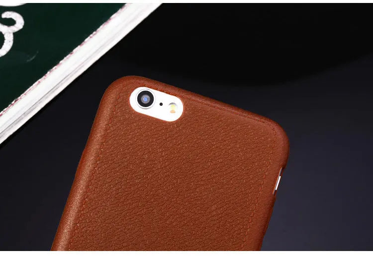 Leather and TPU iPhone case in black, shown on an iPhone.