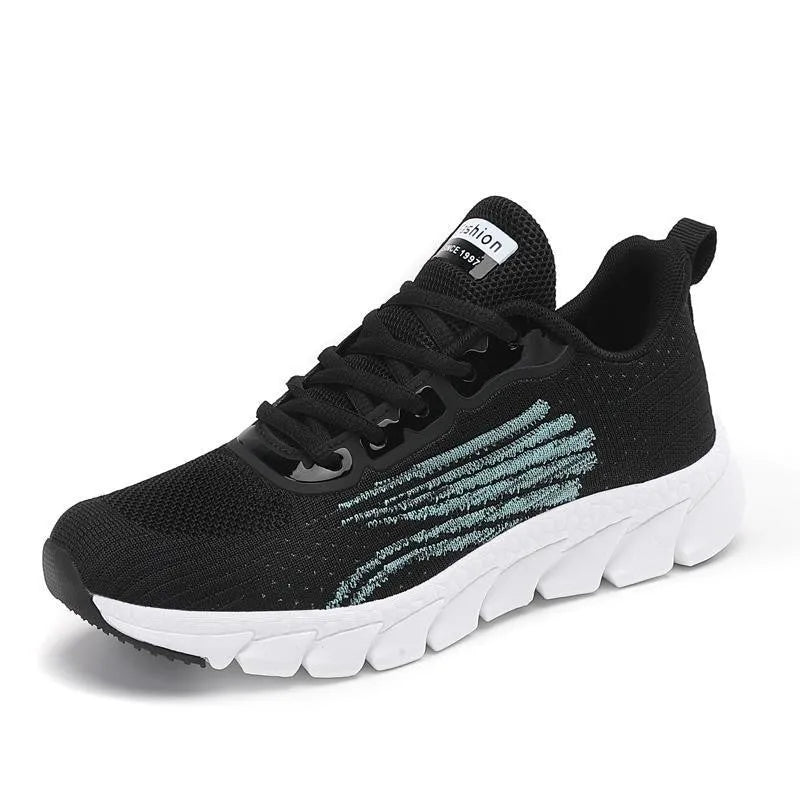 Low-top black and white running sneakers with cross strap design and MD sole