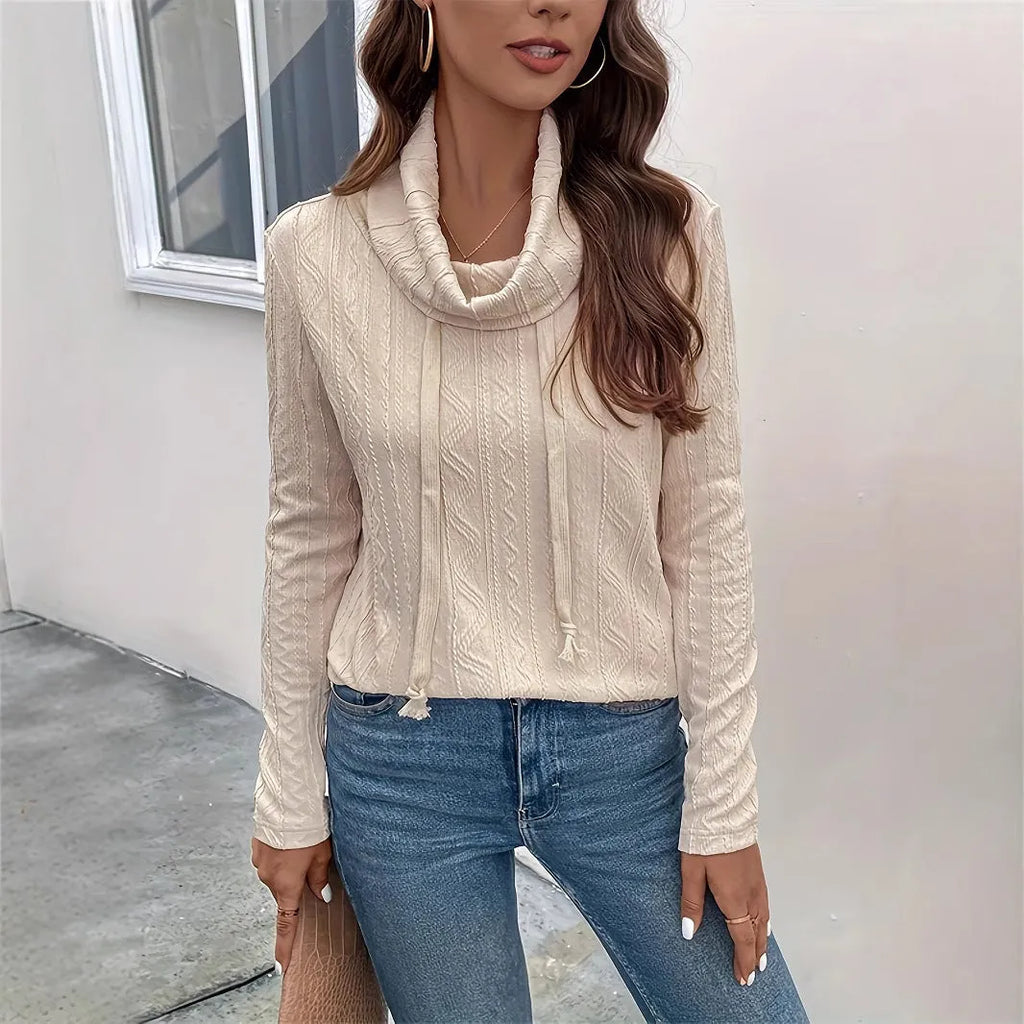 Apricot-coloured women's pullover hoodie with a drawstring hood and long sleeves laid flat.