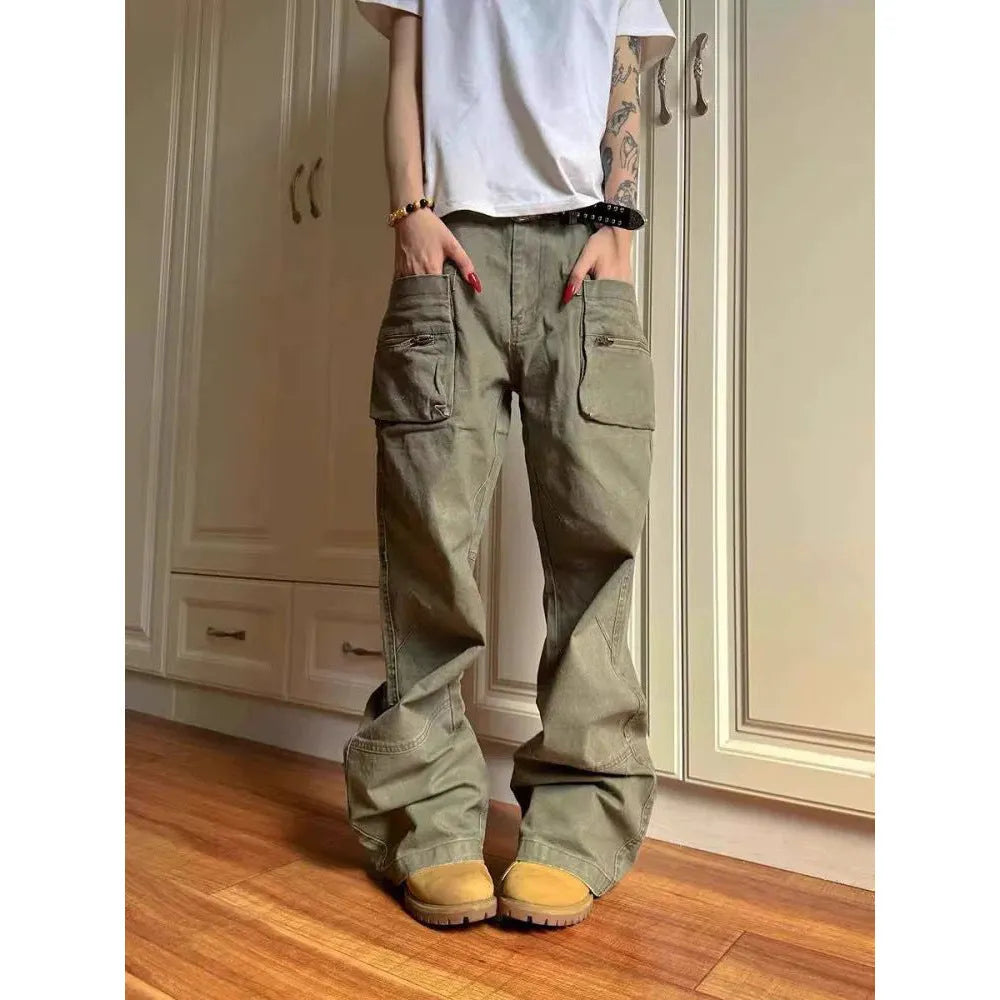 Green and black cotton casual trousers with double zipper detail and pockets on a mid-waist design.
