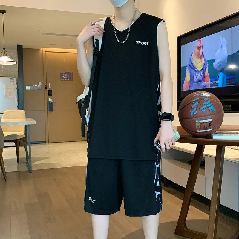Men's grey polyester sleeveless basketball vest and matching shorts sports set laid flat
