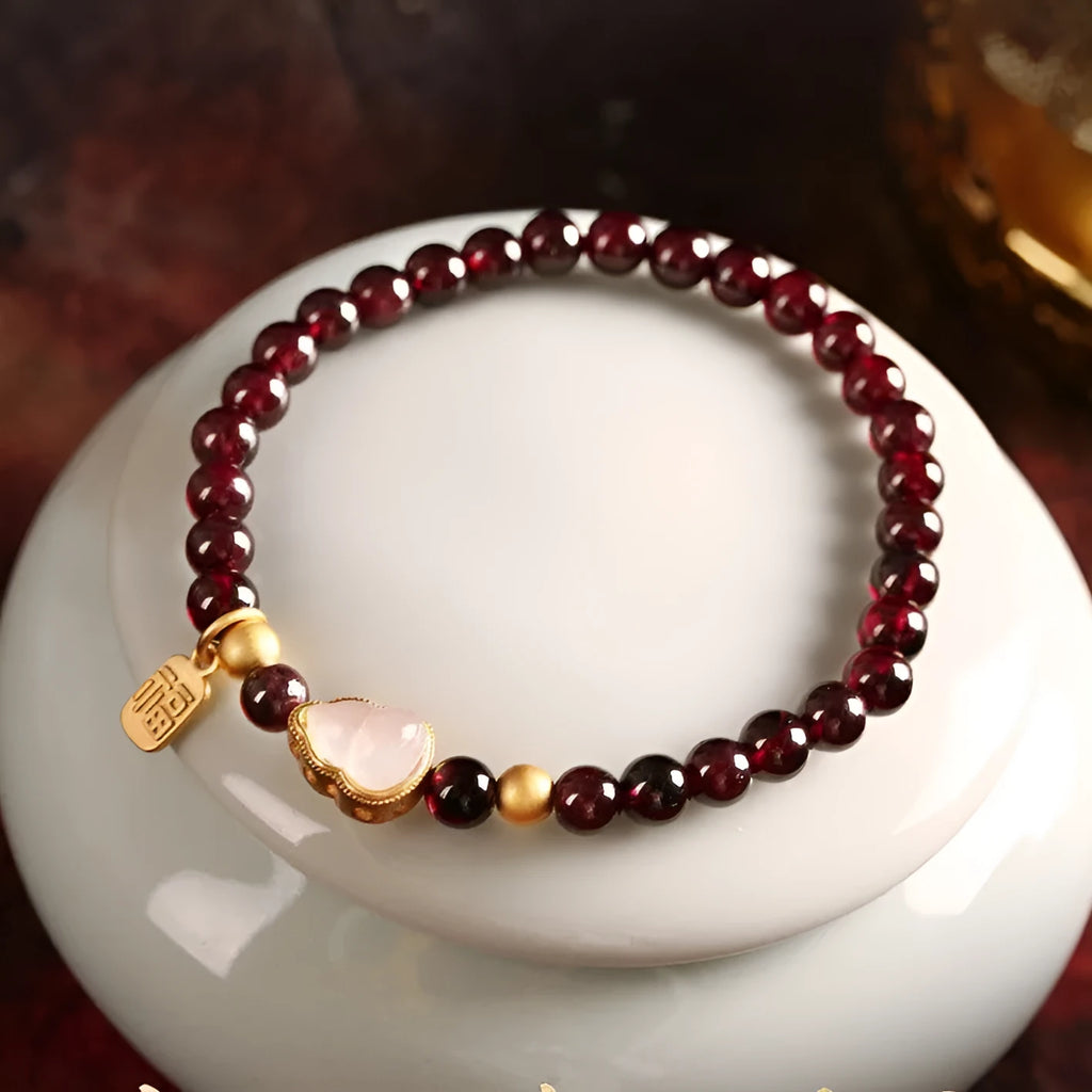 Chinese style gourd bracelet with imitation garnet beads and Fu character charms in U-shaped design