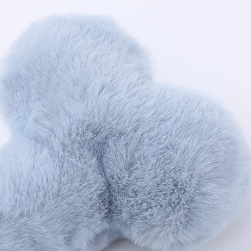 Blue bone-shaped plush dog toy with squeaker and grinding teeth texture for interactive play