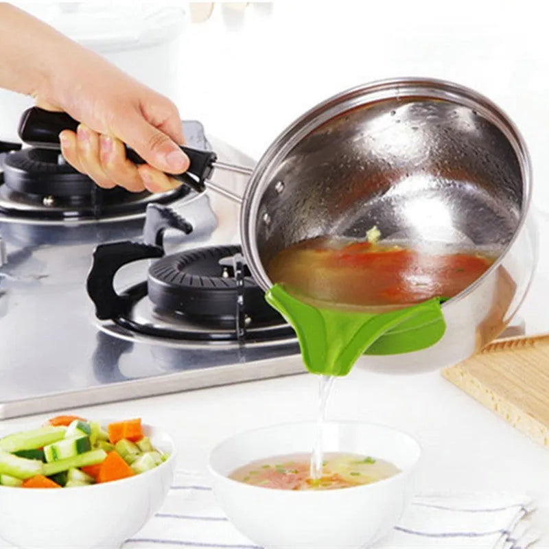 Green silicone clip-on kitchen funnel for pouring liquids into round pots.