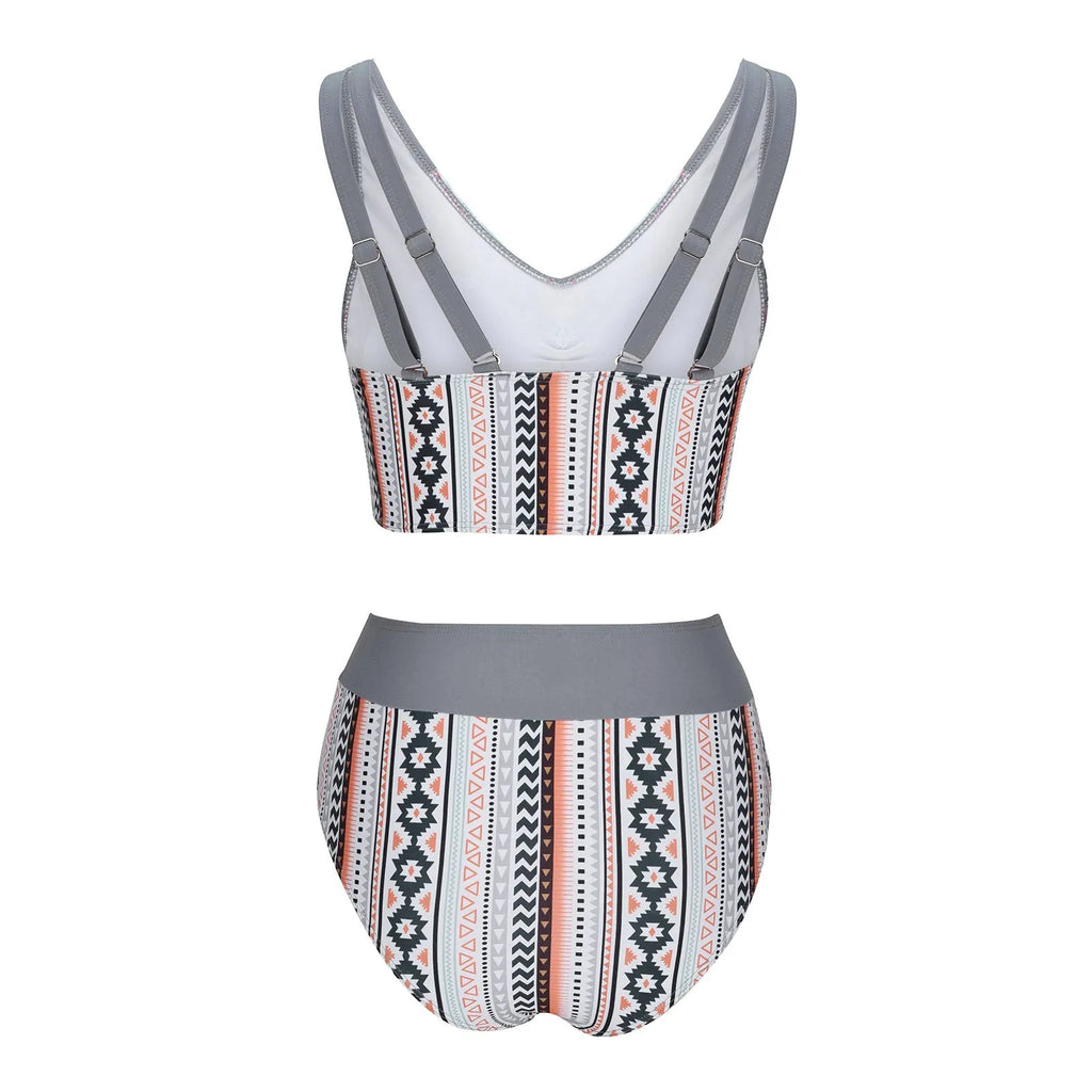 Blue women's one-piece swimsuit with cross-strap back, shown on a mannequin.