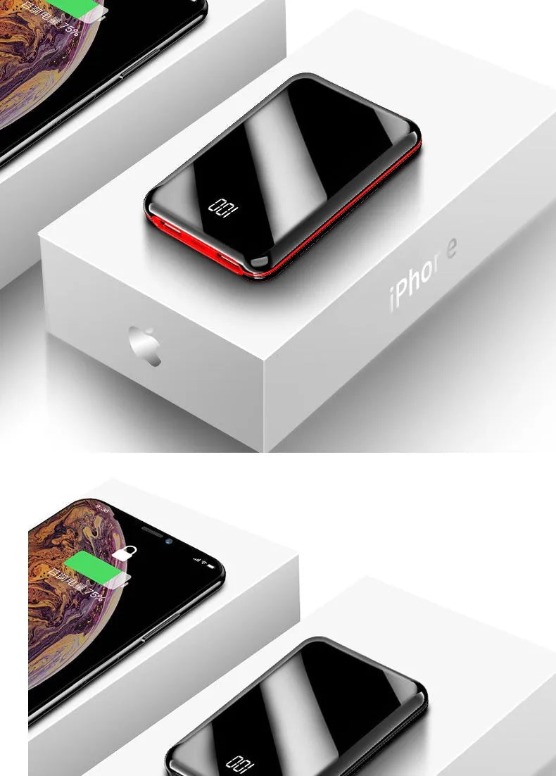 Black mini power bank with digital LCD screen showing battery percentage, next to a smartphone.