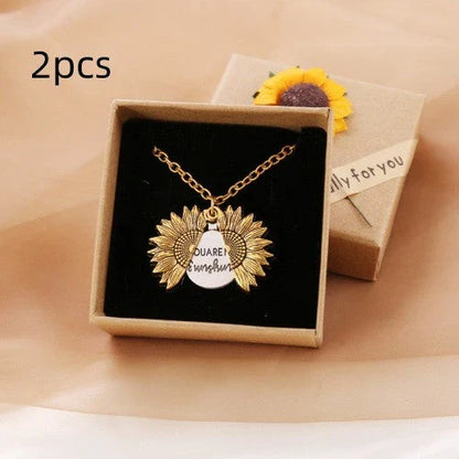 A stunning sunflower pendant necklace with an adjustable chain in various fashionable colors