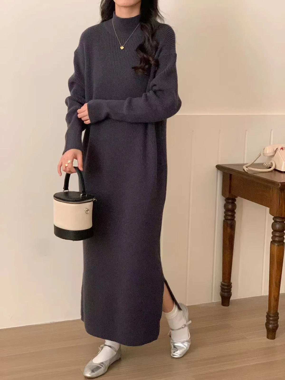 Women's acrylic knitted dress with half turtleneck, long sleeves, and midi length in solid colour