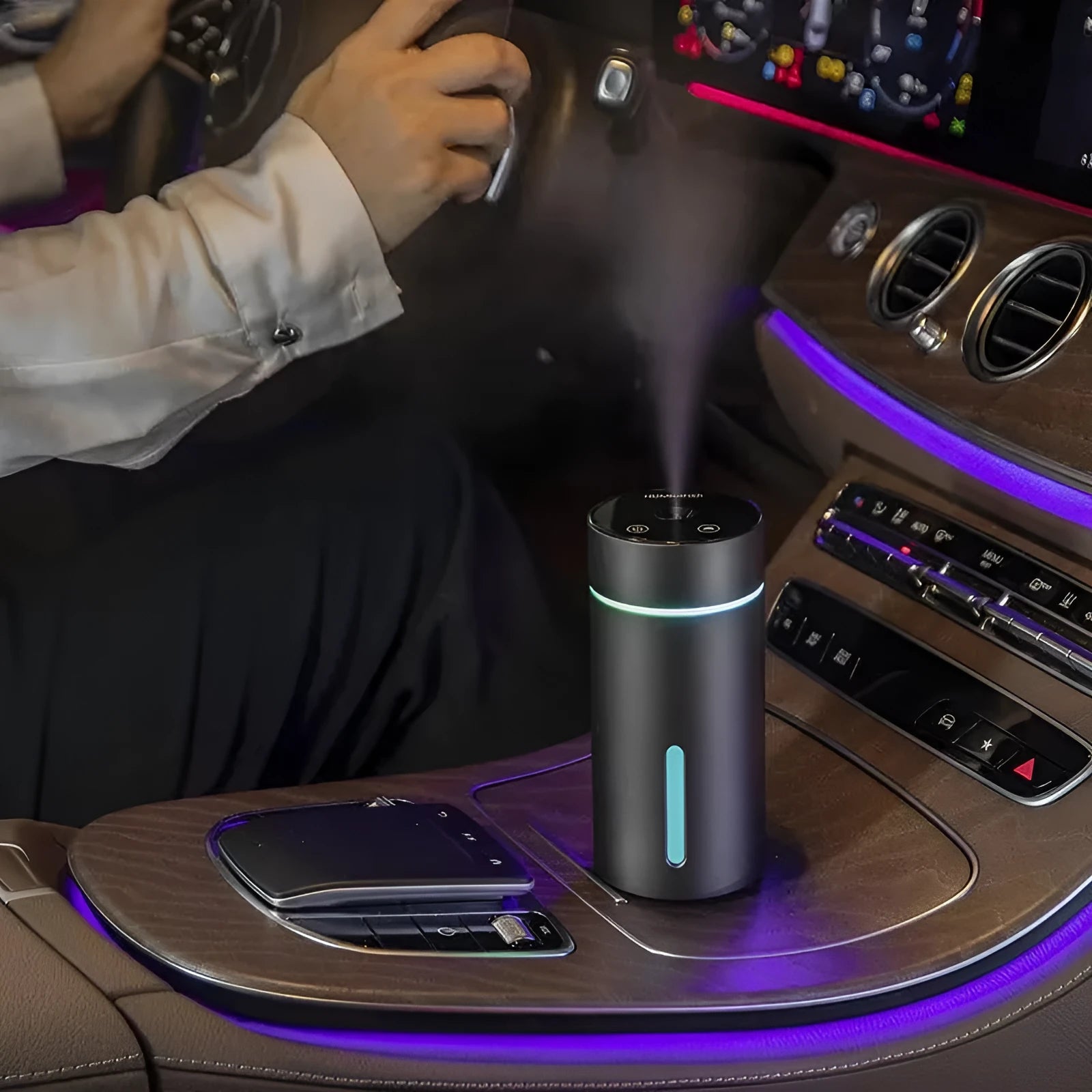 Compact aluminium car air humidifier and essential oil diffuser with night light on wooden desk