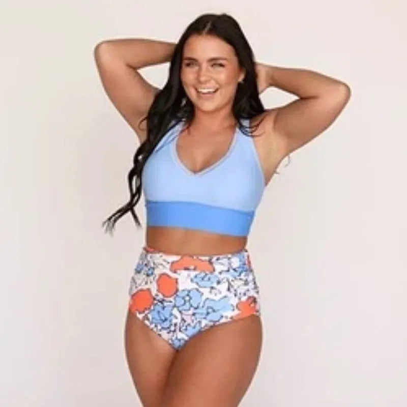 Women's conservative blue polyester one piece split swimsuit with vest top and full coverage