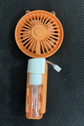 USB rechargeable handheld plastic nozzle fan in apricot colour showing three speed buttons.