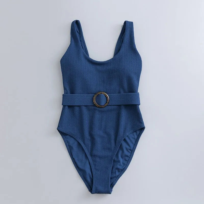 Navy blue one-piece women's swimsuit with a triangle neckline and slimming fit on a mannequin.