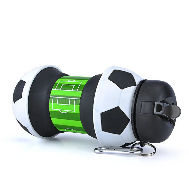 Collapsible white soccer ball shaped silicone water bottle with straw and carrying clip, 18 oz capacity