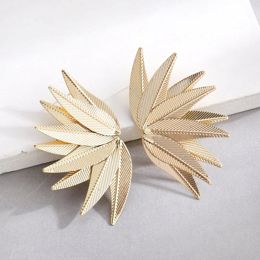 Gold and white leaves patch earrings with detailed leaf design made from alloy metal