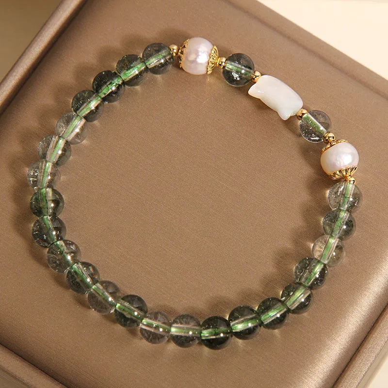 Green phantom quartz women's bracelet with a delicate shell kitten charm.