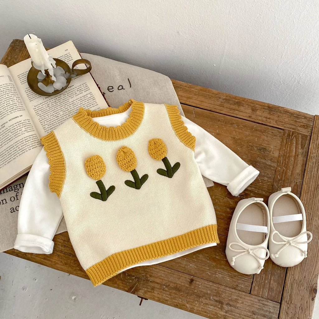 Baby girl sleeveless knitted pullover top in almond white with three-dimensional flower detail, spring autumn cotton knit