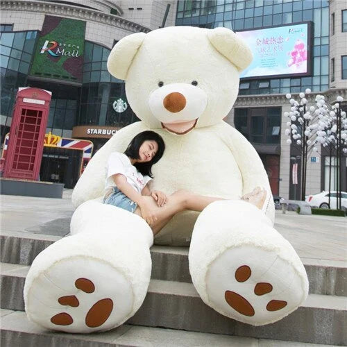 A plush, giant teddy bear with realistic facial features and a soft, huggable design