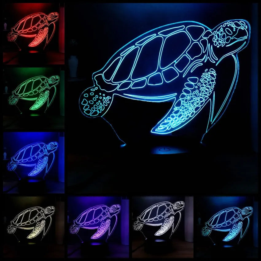 3D clear acrylic turtle-shaped LED night light with remote control on a desk.