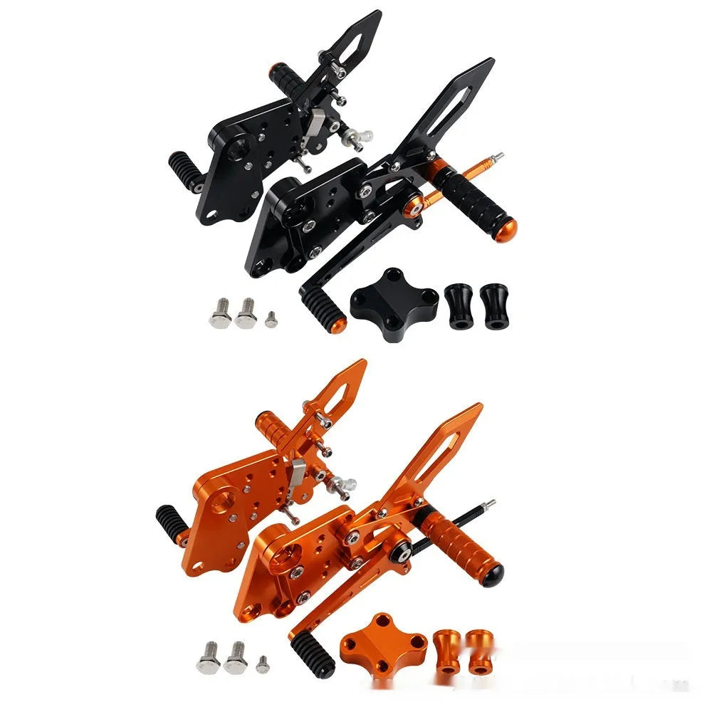 KTM Duke foot pedal bracket assembly for raised rear shift pedal in black or orange