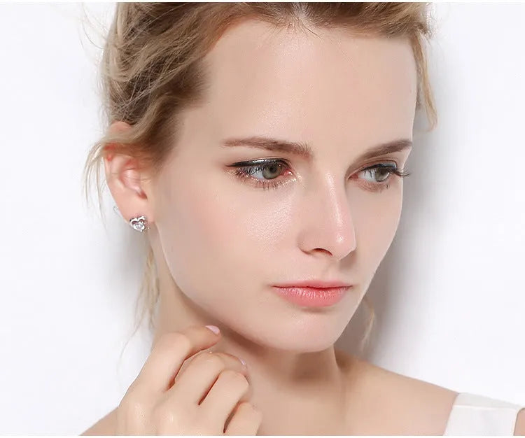 Silver heart-shaped zircon earrings for women, available in purple or white colour, with sterling silver inlay and electroplating finish.