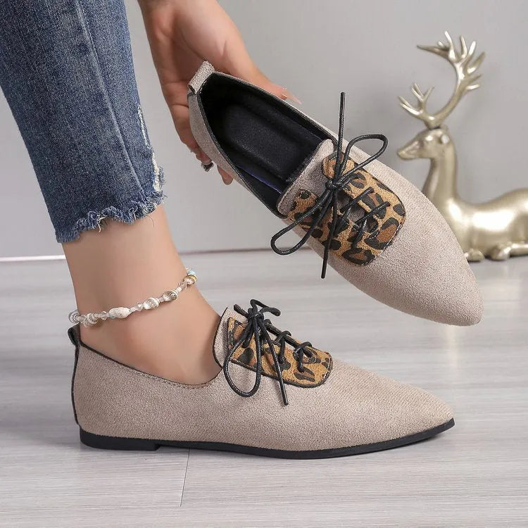 Beige leopard print pointed toe stiletto pumps for women, showing the shoe's side profile.