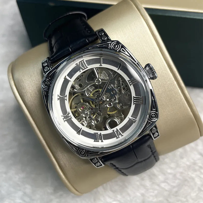 Hollow out business watch with white leather band, round dial, spiral crown, and transparent case back on a white background.