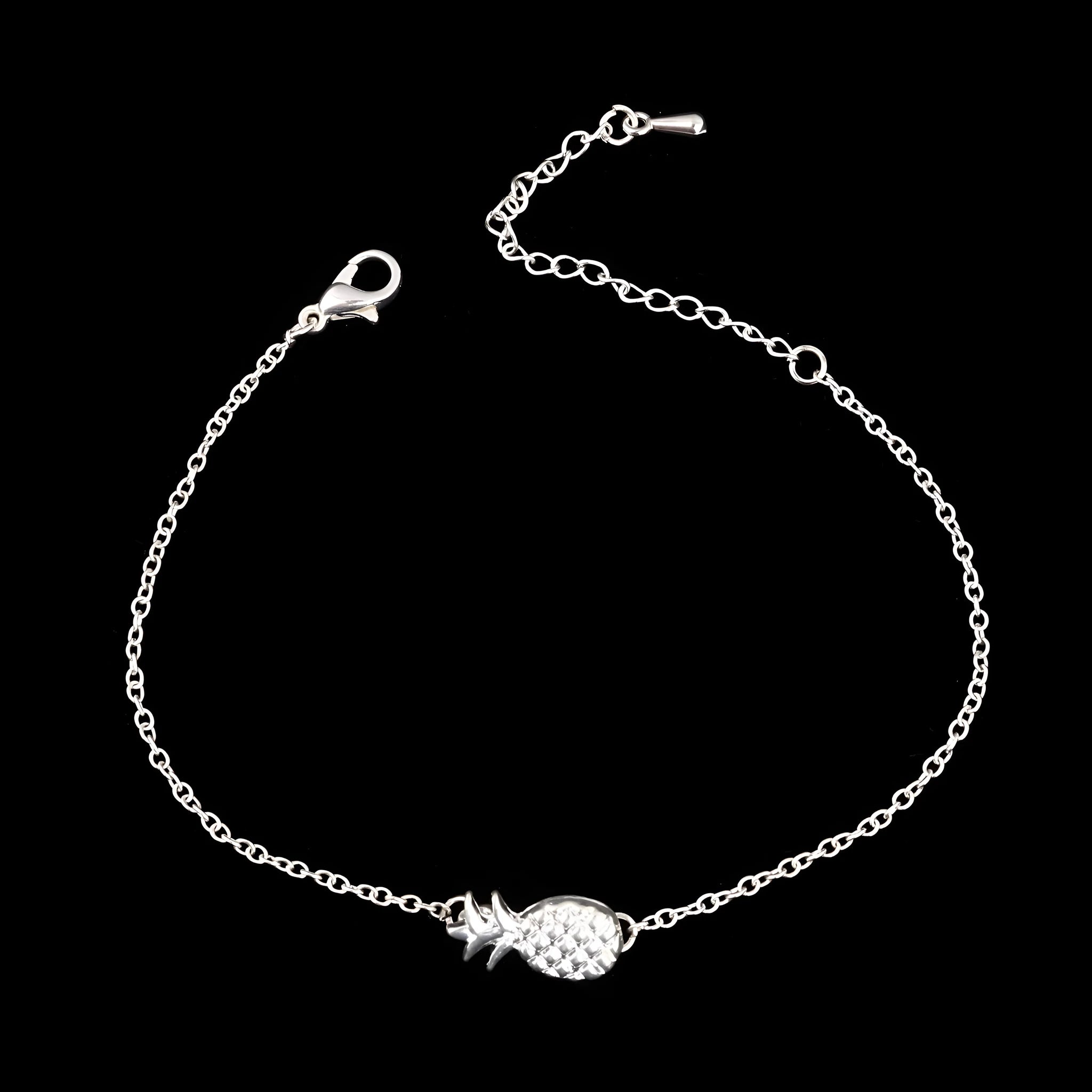 Close-up of a women's alloy bracelet featuring a detailed pineapple charm in a gold or silver tone.