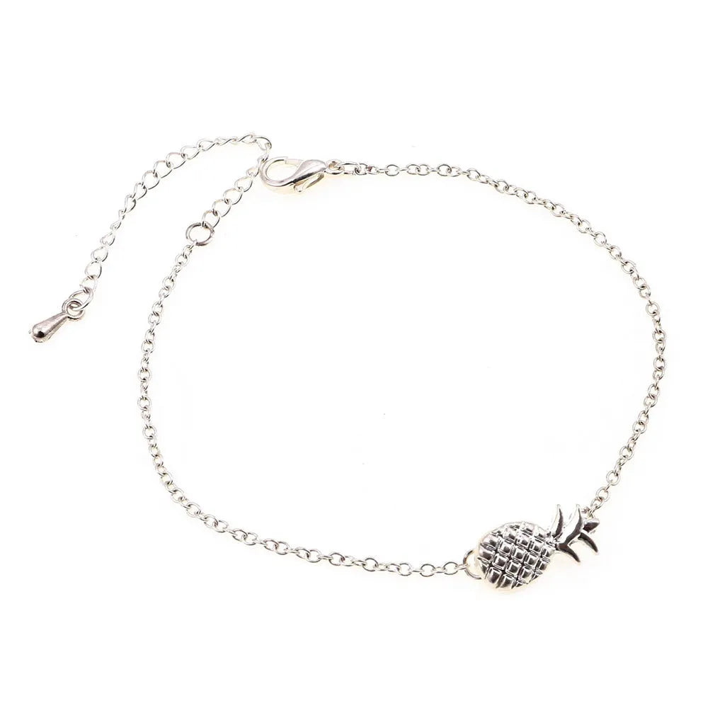 Close-up of a women's alloy bracelet featuring a detailed pineapple charm in a gold or silver tone.