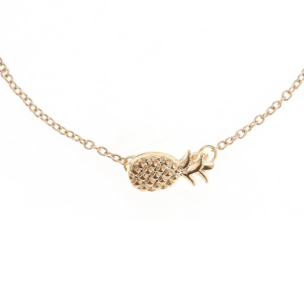 Close-up of a women's alloy bracelet featuring a detailed pineapple charm in a gold or silver tone.