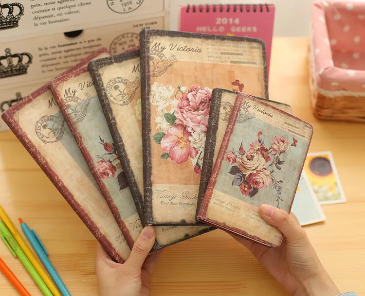 Hardcover notebook with retro floral cloth pattern in Lily, Peony, or White Rose designs, showing 25K and 50K sizes.