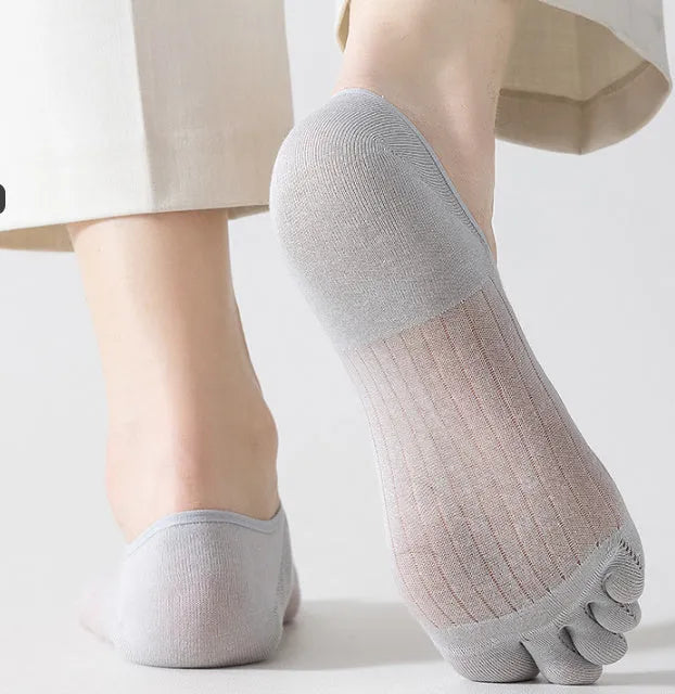 Modal cotton five-finger boat socks in black, shown as a pair laid flat to detail the individual toe design.