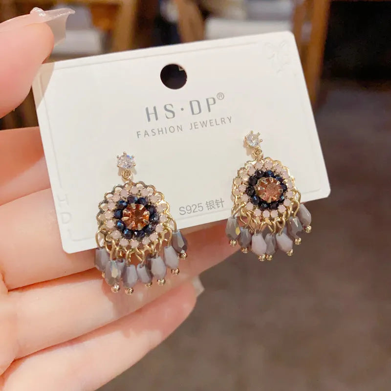 Geometric crystal tassel drop earrings with diamond embedded stones and thick gold plating