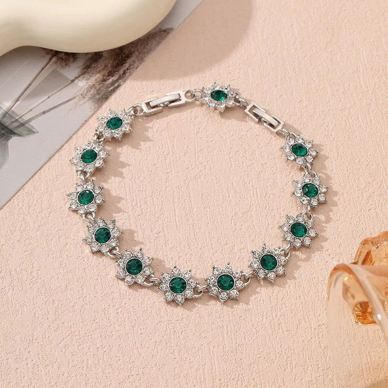 Luxury style bracelet with coloured gems and floral design on zinc alloy with electroplated finish