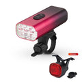 USB rechargeable bicycle headlight and taillight set with plastic mounting bracket on a bike.