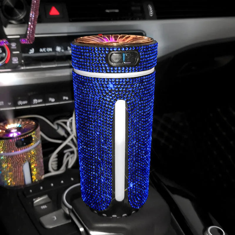 Rhinestone-decorated USB car humidifier with LED lights on a dark background.