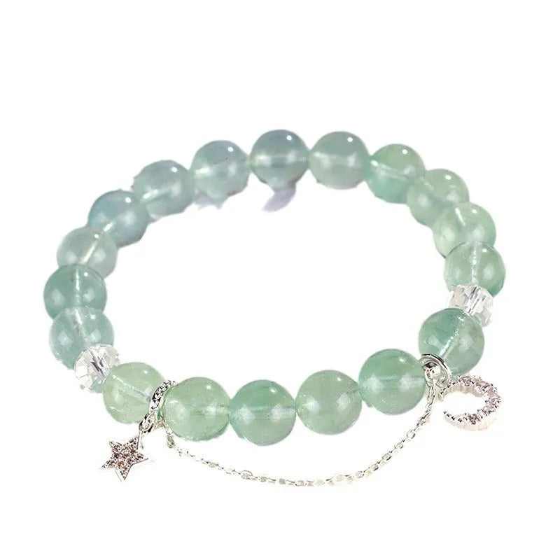 Green fluorite bracelet with star and moon princess design showing natural stone asterism patterns