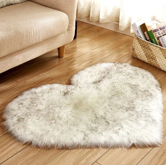 Soft and plush heart-shaped rug in various colors, perfect for cozy home decor