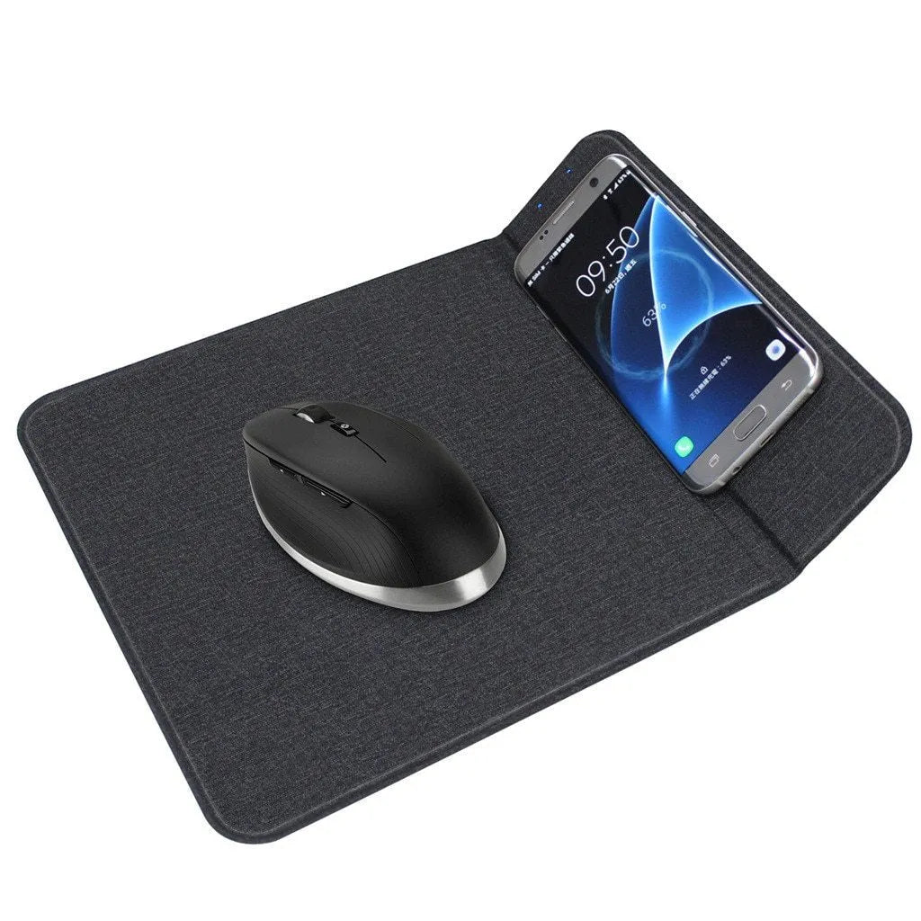 Black 2-in-1 wireless charging mouse pad on a desk with a phone resting on the built-in bracket