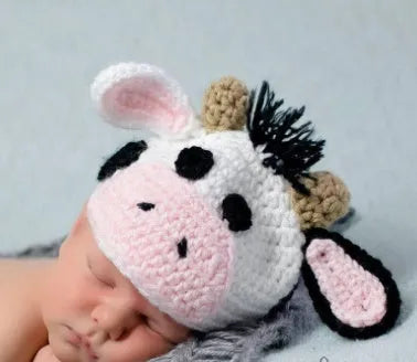 Hand-knitted white baby cow suit set with matching hat and pants for newborn infants