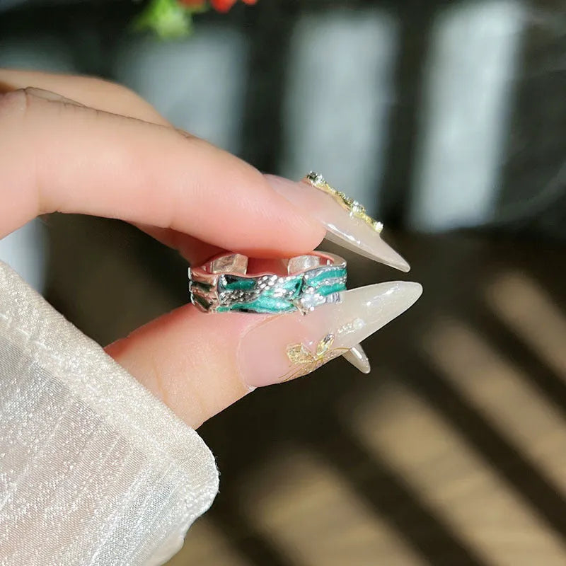 Mint green enamel asterism ring with folded copper construction and dripping oil treatment