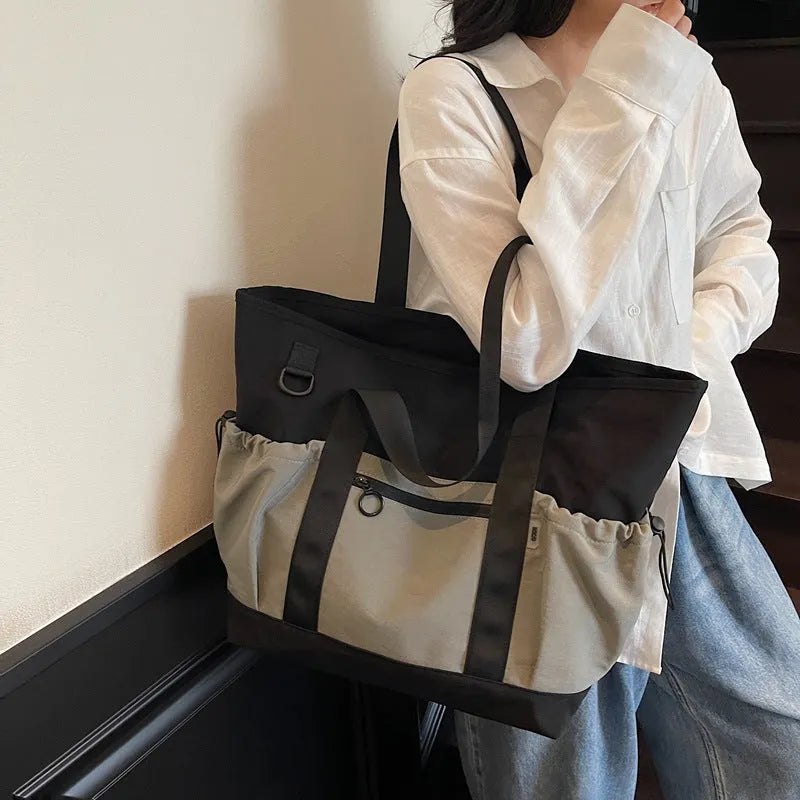 Women's lightweight Oxford cloth travel bag for yoga and fitness in grey colour with letter pattern.