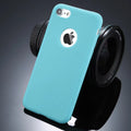Soft silicon TPU iPhone case in a choice of candy colours on a table.